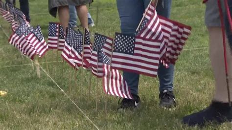 Hundreds gather to help plant Boston Common Memorial Day Flag Garden